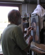 Roy painting in his studio